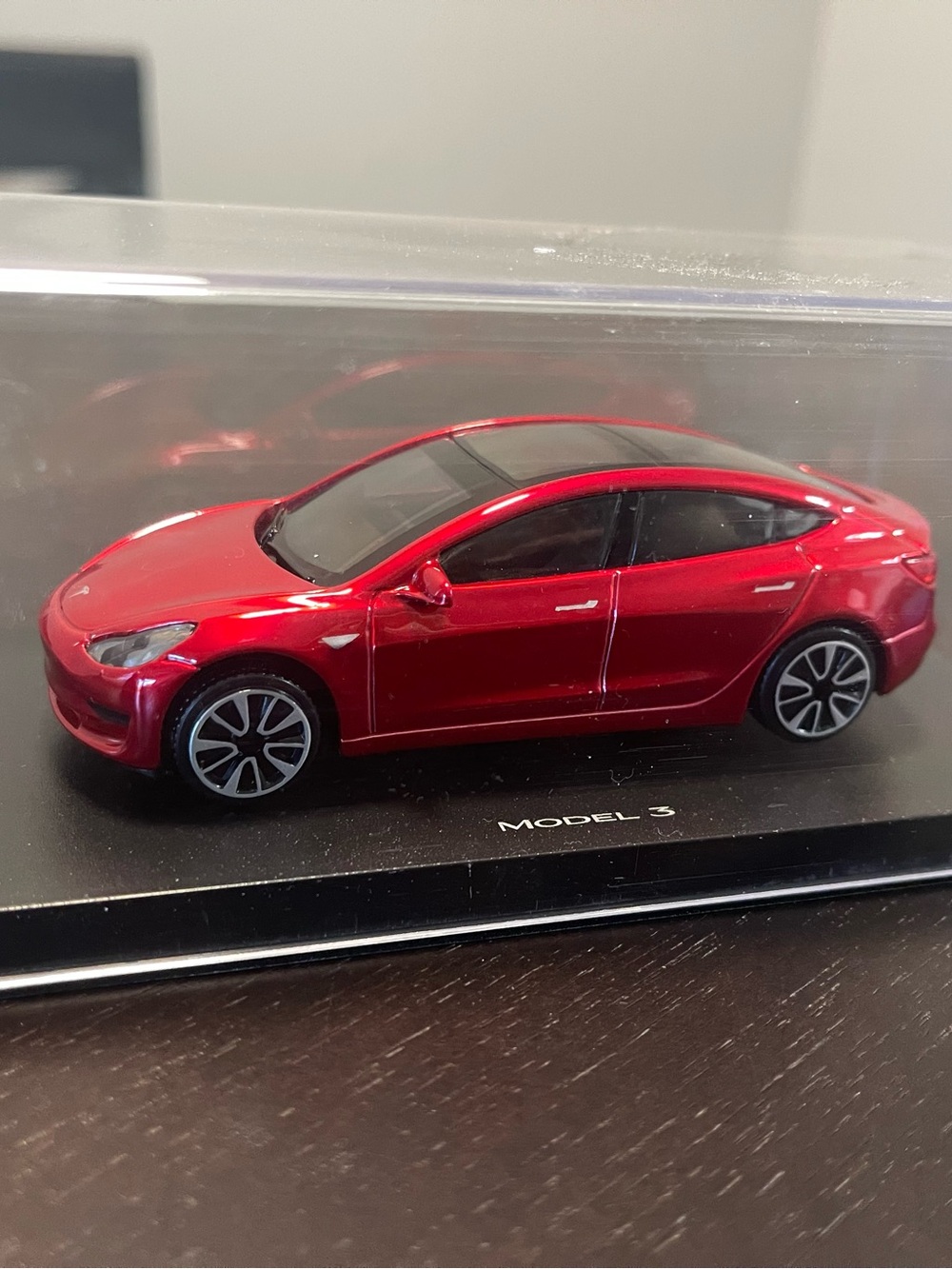 Unopened Red Tesla Model 3 diecast car